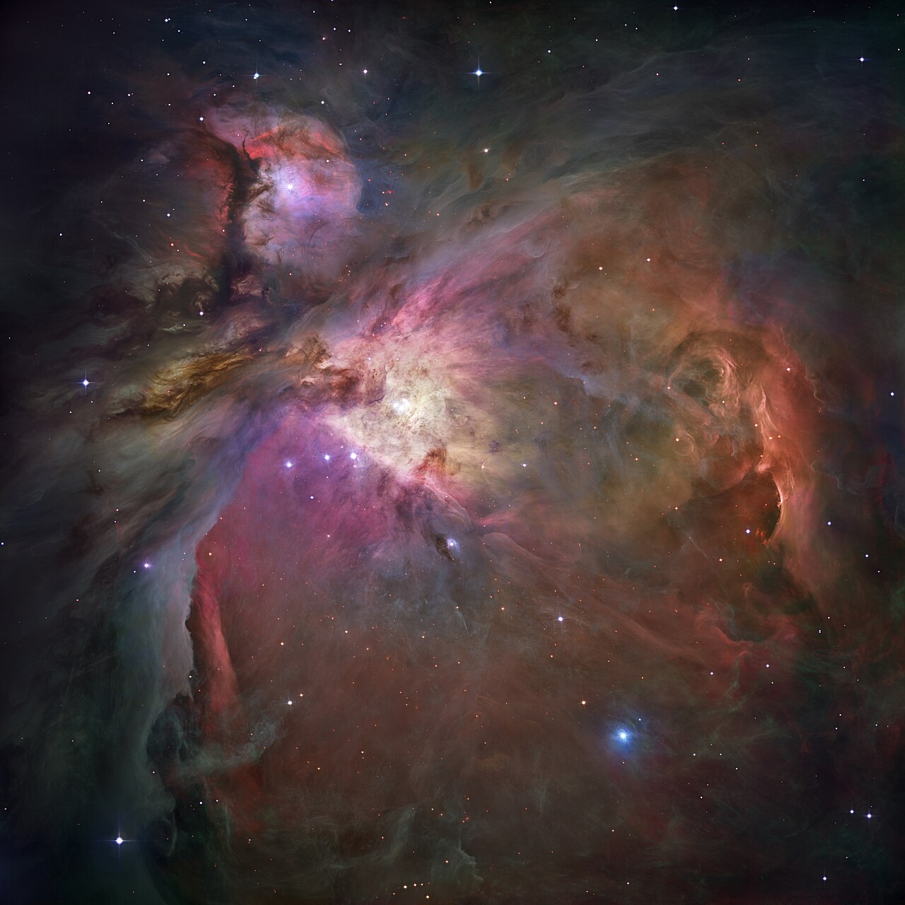 The Orion Nebula: 1,344 light-years of gas and dust in the act of becoming stars. NASA/ESA, public domain.